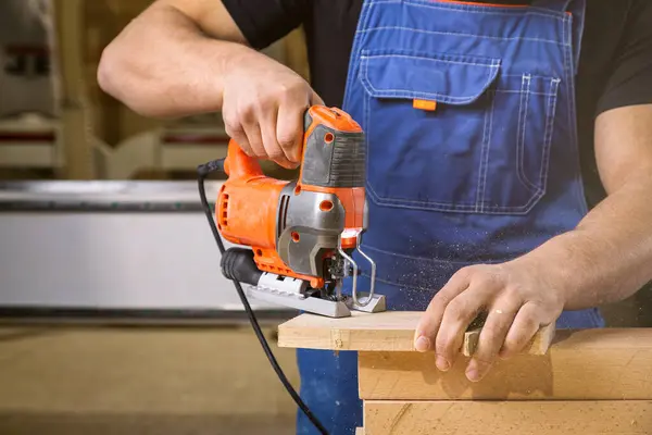 Carpenter Using Jigsaw Cut Wood Cuts Bars Home Repair Concepts — Stock Photo, Image