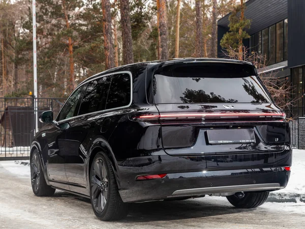 stock image Novosibirsk, Russia - December 01 , 2023:   black      LI L9,  SUV parked in  park,  back  view