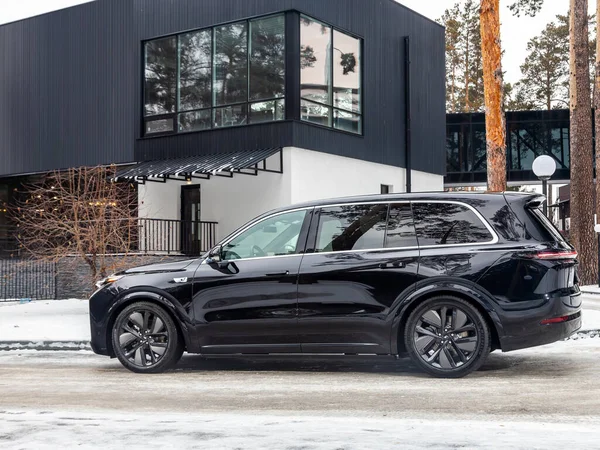 stock image Novosibirsk, Russia - December 01 , 2023:   black      LI L9,  SUV parked in  park,  side  view