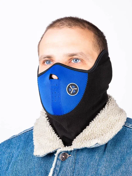 Black and blue balaclava for cycling in cold weather isolated on white background