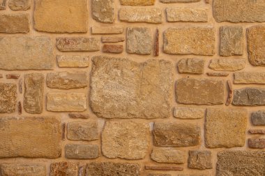 Kahverengi-gri taş duvarın arka planı. Tahta duvar dokusu ve arkaplan deseni 