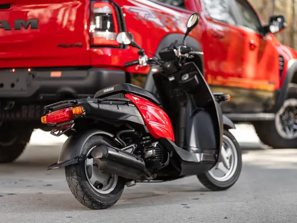 stock image Novosibirsk, Russia -  May 01  , 2024:   red  moped Yamaha Gear ,  back   view,  parking in city