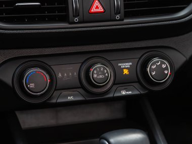 Novosibirsk, Russia -  April 30  , 2024: Kia K3 ,   black car interior: climat control view with air conditioning button inside a car clipart
