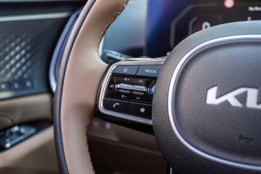 Novosibirsk, Russia -  July 10, 2024: Kia Sorento, Close up of car steering wheel with function buttons clipart