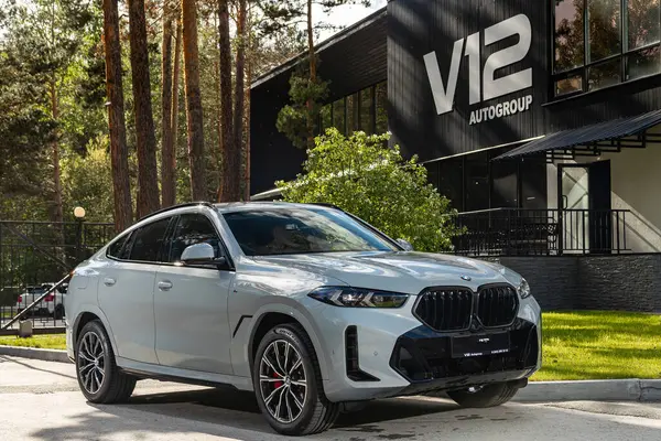 stock image Novosibirsk, Russia -  July 10, 2024: BMW X6 parked in city. No other car and people. 