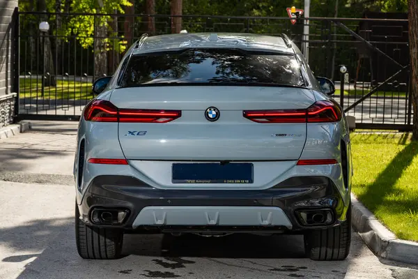 stock image Novosibirsk, Russia -  July 10, 2024: BMW X6 parked in city. No other car and people. 