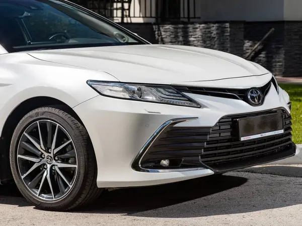 stock image Novosibirsk, Russia -  July 10, 2024: Toyota Camry ,    car with clear light headlight, bumper,  foglights