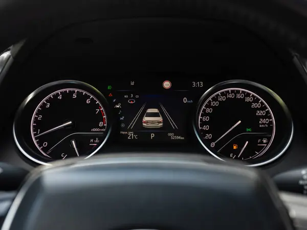 stock image Novosibirsk, Russia -  July 10, 2024: Toyota Camry ,   dashboard of the car is illuminated by bright illumination. Speedometer, circle tachometer, oil and fuel leve