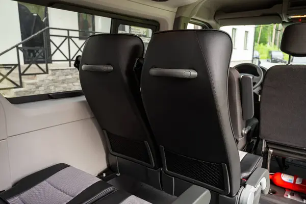 stock image Novosibirsk, Russia -  July 10, 2024:  Renault Master,Clean car interior: black back seats, headrests and belt