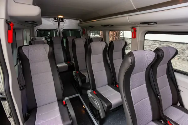 stock image Novosibirsk, Russia -  July 10, 2024:  Renault Master,  interior design, rows of seats with table  in a minivan, car passenger seats with seats belt.