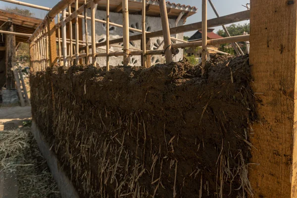 a bioconstruction, earthen walls built with straw and mud