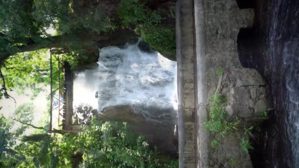 Rushing Waterfall Cascading Rocky Cliffs Golden Hour — стоковое видео