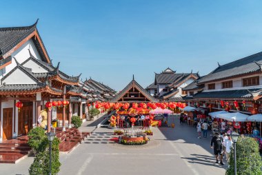 Suphan Buri, Thailand - Jan 24, 2023: Beautiful landscape of shops and restaurants built in Chinese traditional architecture at the Suphan Buri City Pillar Shrine.