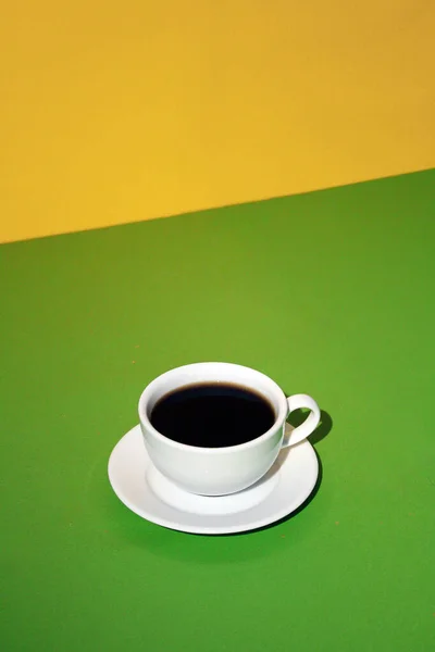 cup of coffee on a green background