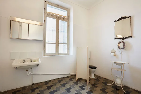 Bathroom in apartment interior in old country house