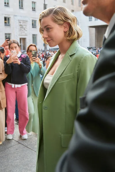 Milan, Italy - September, 23, 2022: woman wearing velvet green