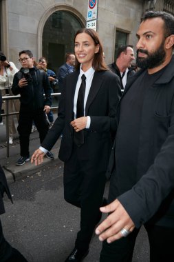 MILAN, ITALY - SEPTEMBER 25, 2022: Irina Shayk before Giorgio Armani fashion show, Milan Fashion Week street style