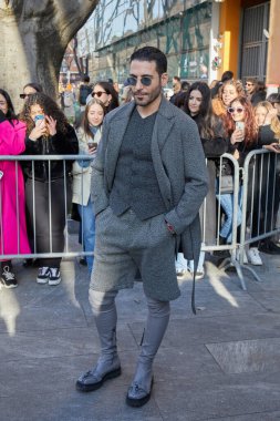 MILAN, ITALY - JANUARY 14, 2023: Actor Miguel Angel Silvestre before Emporio Armani fashion show, Milan Fashion Week street style
