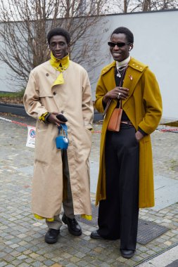 MILAN, ITALY - JANUARY 15, 2023: Mamadou Diagne and Tourek Hadim before Etro fashion show, Milan Fashion Week street style