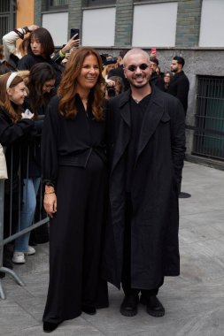 MILAN, ITALY - FEBRUARY 23, 2023: J Balvin and Roberta Armani before Emporio Armani fashion show, Milan Fashion Week street style