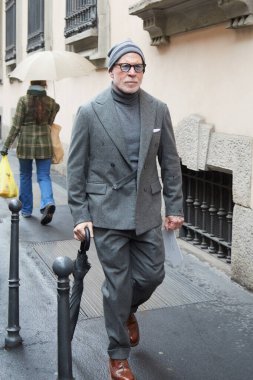 MILAN, ITALY - JANUARY 20, 2025: Nick Wooster before Giorgio Armani fashion show, Milan Fashion Week street style clipart