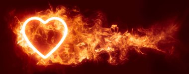 Glowing heart in an inferno of red hot flames wallpaper or Valentine's background. Symbolizing passion, lust, or desire. clipart