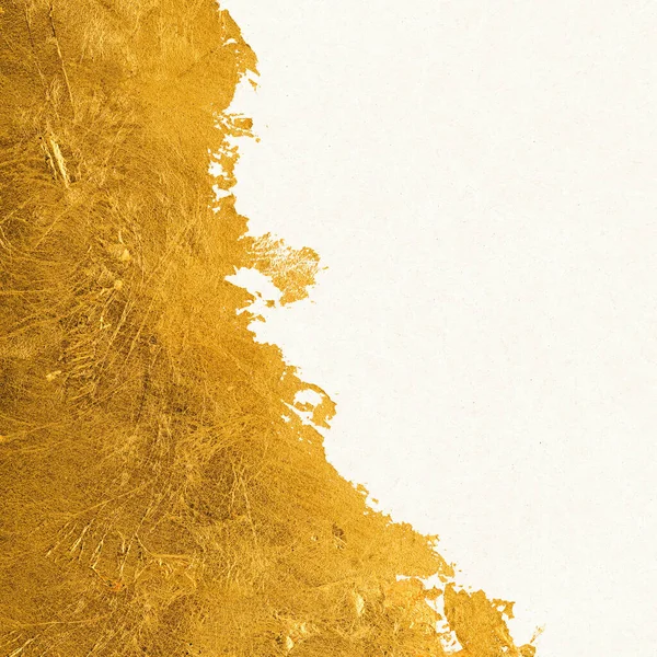 Shiny Textured Gold Leaf Foil Torn White Paper — Stock Photo, Image