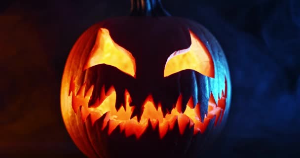 Spooky Halloween Jack Lantern Glowing Scary Face Carved Out Pumpkin — Stock Video