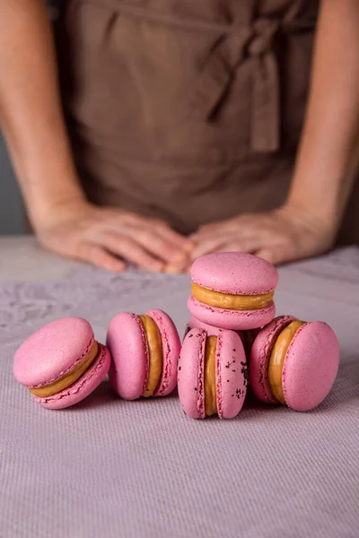 Skilled Woman Pastry Cook Presents Macaroons Desert - Flavorful Treats