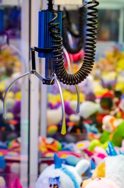 stock image A claw crane game machine with toys