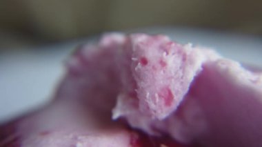 Macro shot of ice cream melting. Strawberry and chocolate ice cream melts timelapse. High quality 4k footage