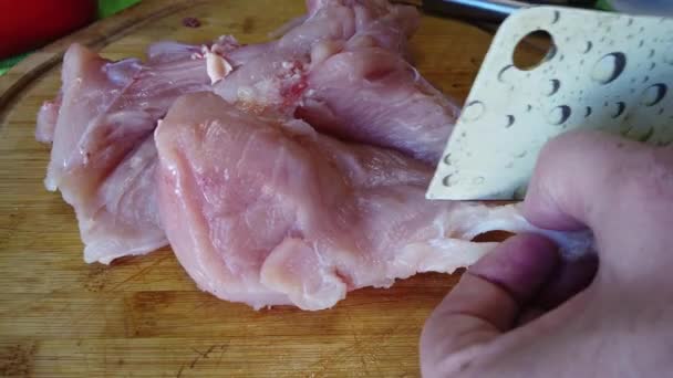 Male Hands Using Cleaver Cut Raw Chicken Breast Overhead Slow — Vídeo de stock