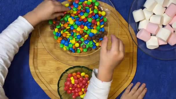 Kids Activity Kitchen Separating Colorful Candies Overhead Shot High Quality — Stock Video