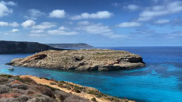 stock image Natural rock windows on Comino island Malta. sea with the access to the caves near Santa Marija tower. High quality photo