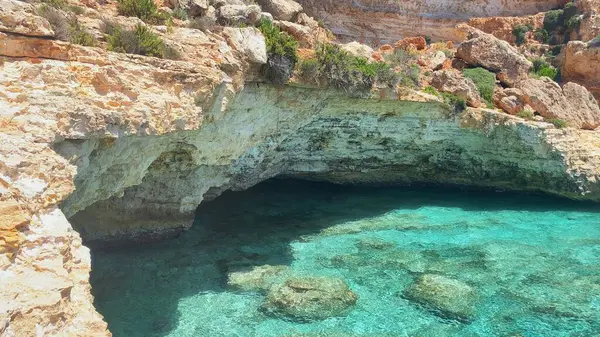 stock image Crystal clear turquoise sea water and limestone clifs in Mediterranean sea. Moon beach, Comino, Malta. High quality photo