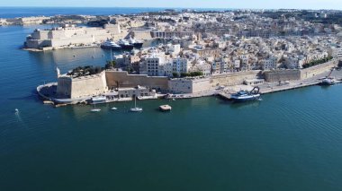 Aerial view of Gardjola gardens - safe heaven gardens, Senglea Point, revealing Fort St. Angelo on the left and Birgu waterfront with Malta Maritime museum. . High quality photo clipart