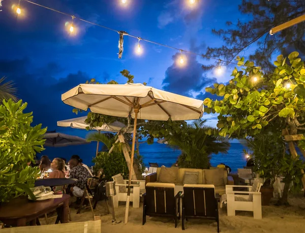 Grand Cayman, Cayman Islands, June 11th 2023, view of Tillie's at dusk, a restaurant on Seven Mile Beach