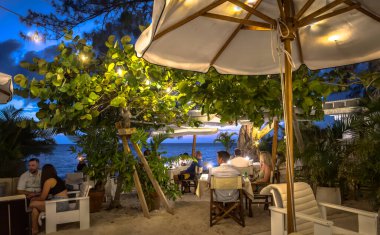 Grand Cayman, Cayman Islands, June 11th 2023, view of Tillie's at dusk, a restaurant on Seven Mile Beach