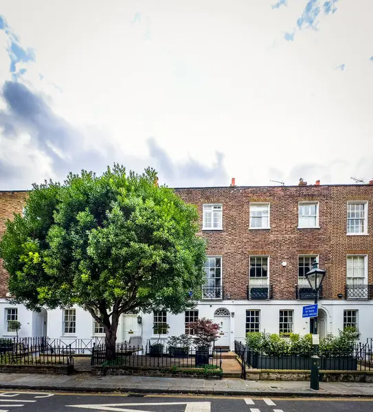 stock image England, United Kingdom, Aug 30th 2023, view of terraced houses on Edwardes Square in the Royal Borough of Kensington and Chelsea