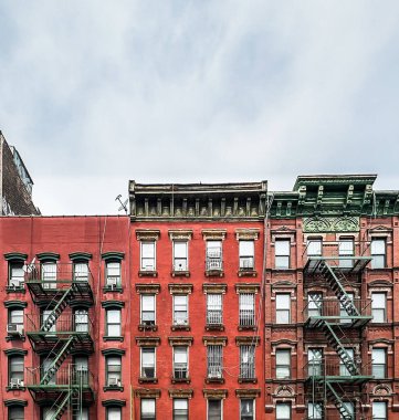 New York City, USA, April 30th 2024, view of typical brick buildings with an outside metal fire escape located on Henry Street