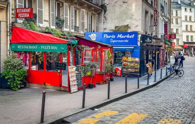 Paris, France, March 25th, 2025, view of an urban scene on a cobbled street in the heart of the Latin Quarter in the 5th district of the capital.