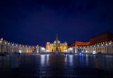 Vatican City (Holy See. St. Peter's Basil cathedral on Saint Square. Nighttime, blue hour with night sky and street lamps illumination. Rome, Italy. Famous travel destination touristic landmark