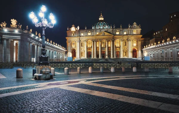 Vatican City (Holy See. St. Peter\'s Basil cathedral on Saint Square. Nighttime, blue hour with night sky and street lamps illumination. Rome, Italy. Famous travel destination touristic landmark