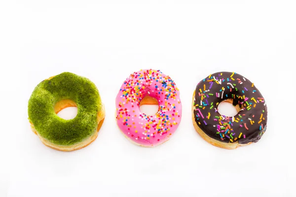 stock image pink, chocolate, green tea donut dessert snack delicious arrangement flat lay style on background white 