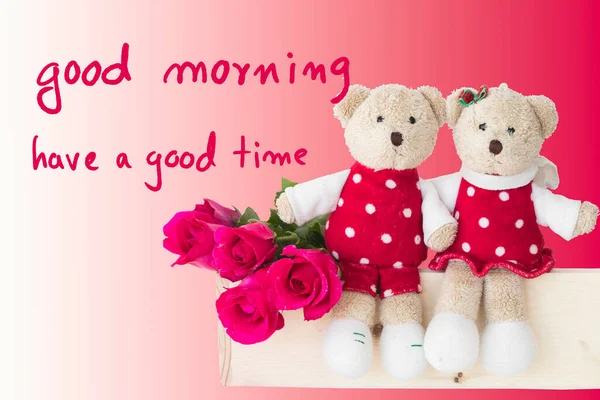 good morning have a good time message card handwriting with couple teddy bear and red rose arrangement flat lay postcard style on background red