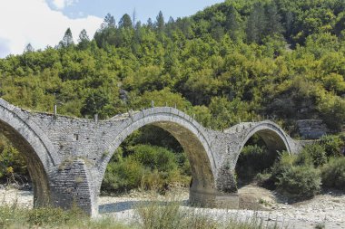 Amazing  view of Medieval Plakidas (Kalogeriko) Bridge at Pindus Mountains, Zagori, Epirus, Greece clipart