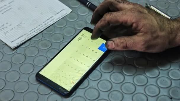Milan Italy October 2022 Mechanic Dirty Hands Use Calculator Scene — Stock Video