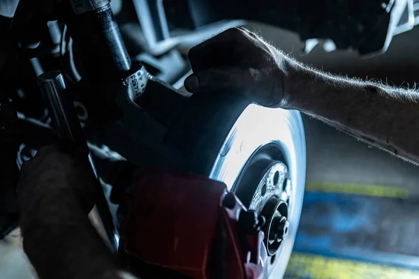 stock image Mechanic hands detail during a maintenance of car brakes