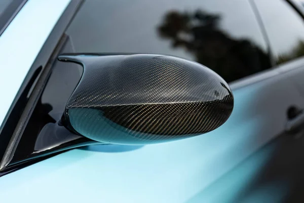 Tuned car rearview mirror in carbon detail