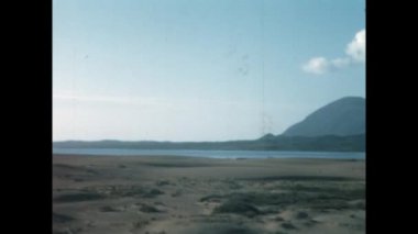 Mykonos, Yunanistan Haziran 1966: 60 'larda doğal Yunan plaj sahnesi